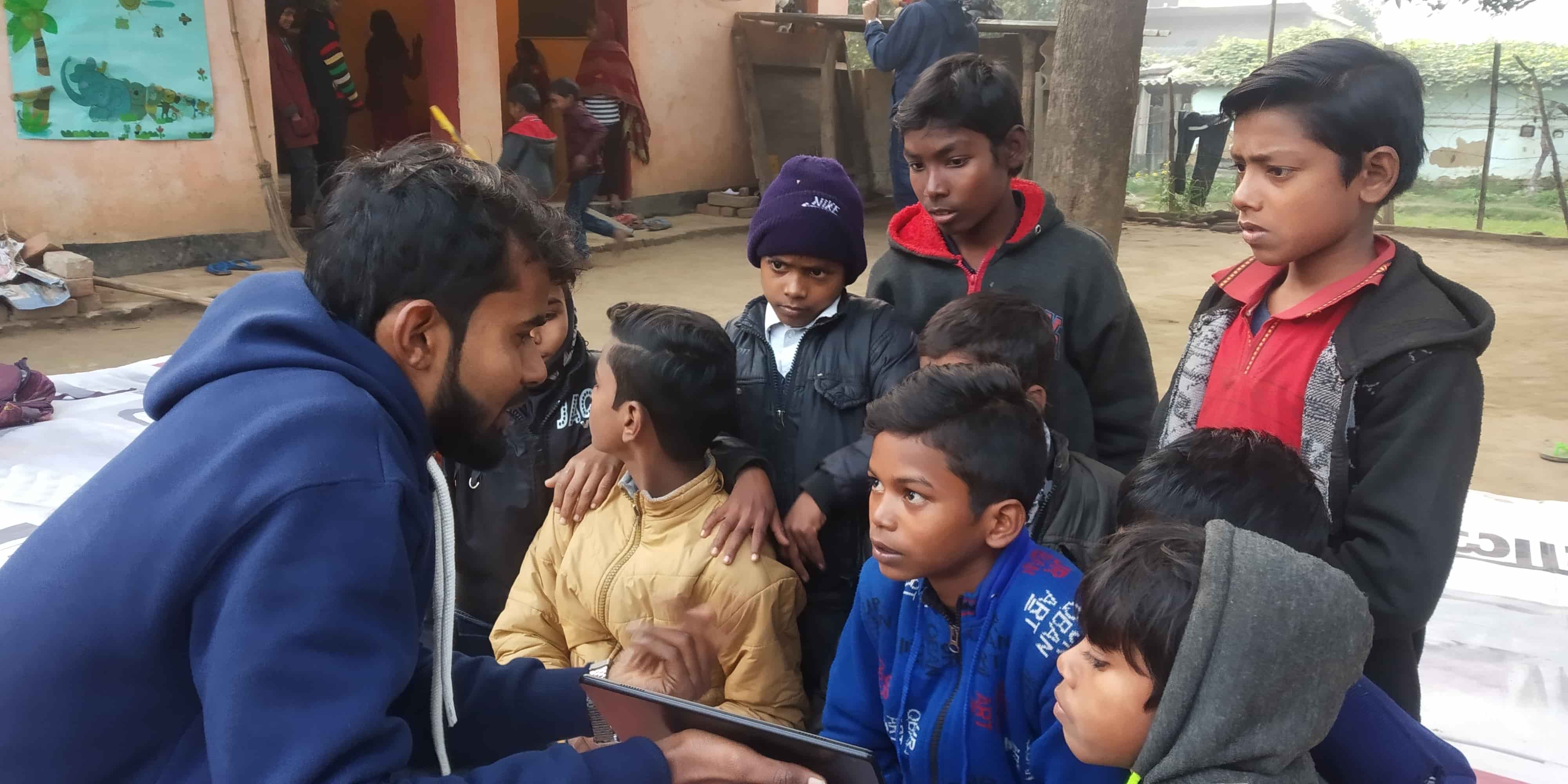 Children learning inside an Education Hut