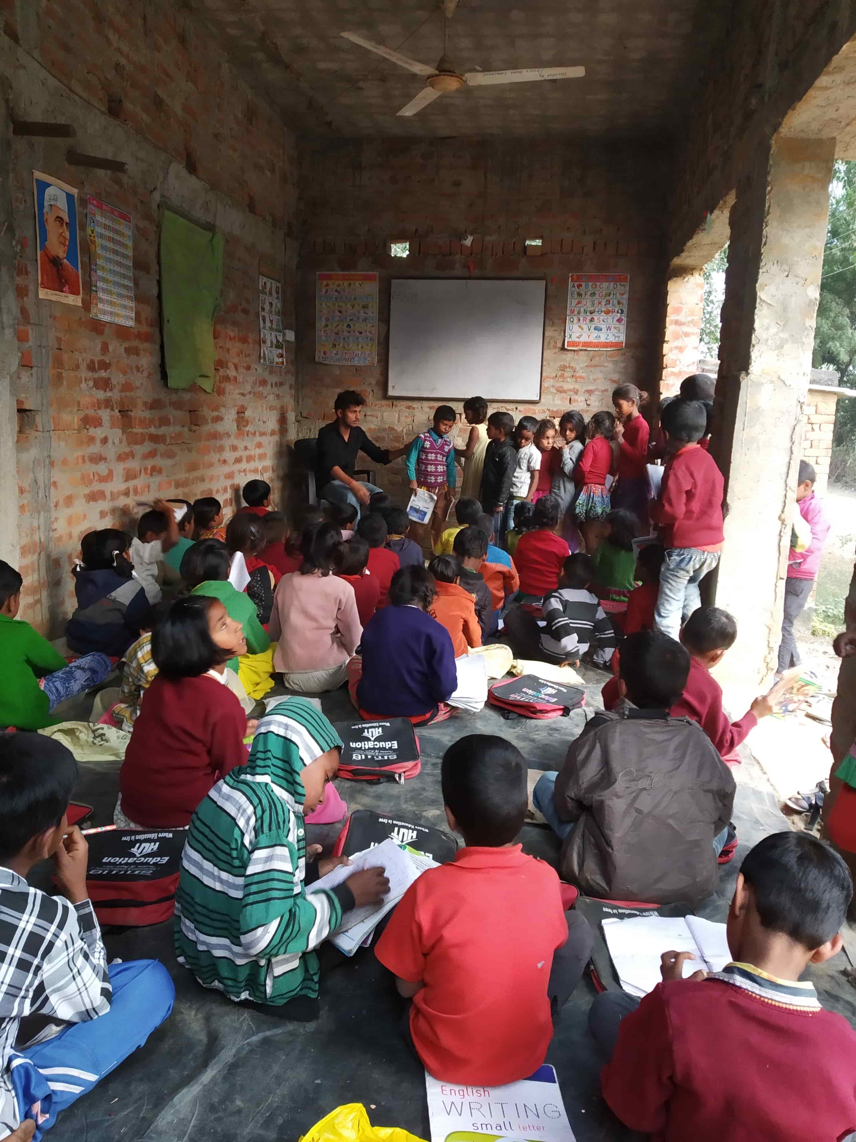 Children participating in activities at an Education Hut